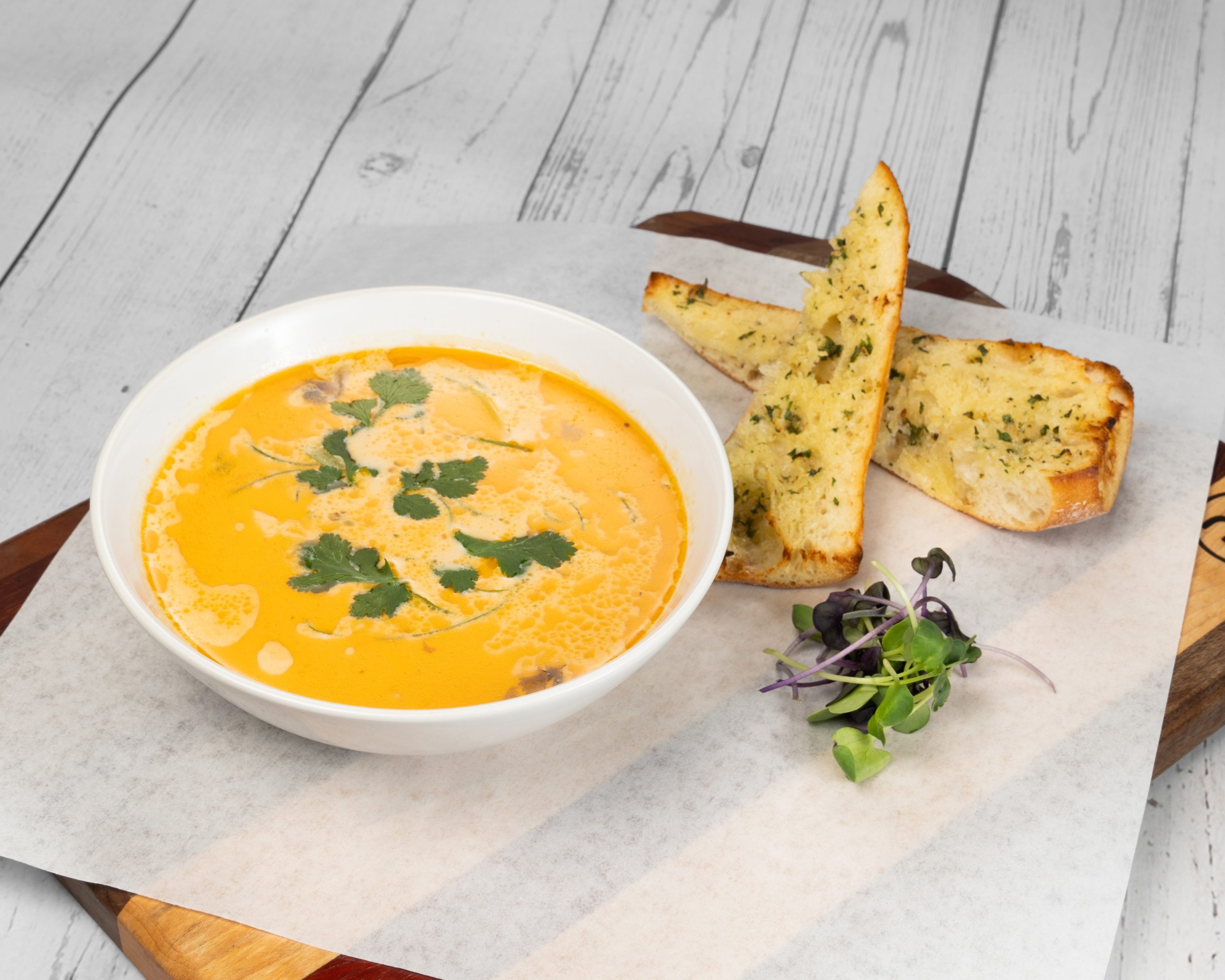 Thai Chicken Soup cup and garlic bread